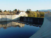 Photo of a flood-gate on a mountain lake.