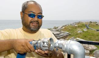 Testing a pump in preparation for field sampling at in Gulf Breeze, Florida.