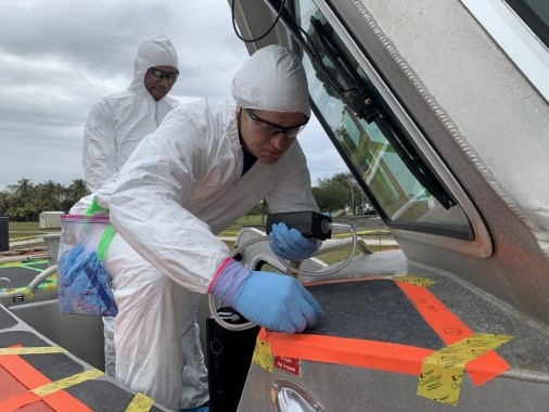 Researchers with the United States Coast Guard conduct sampling for biological spores. 