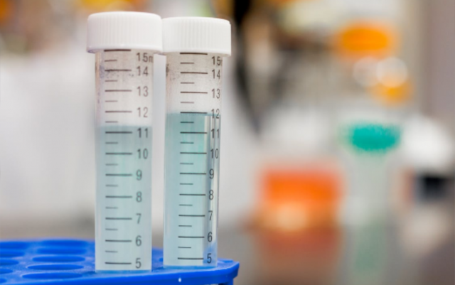 Photograph of two graduated cylinders sitting side by side