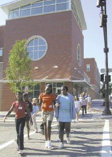 Students crossing the street in front of the school