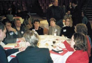 people sitting around a table discussing