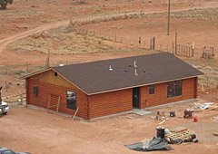 New wood home built to replace contaminated structure