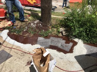 View of injection slurry daylighting at nearby utility pole