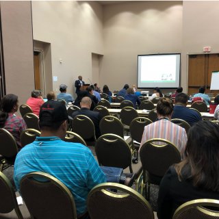 People listening to a session of the Tribal Lead Curriculum.