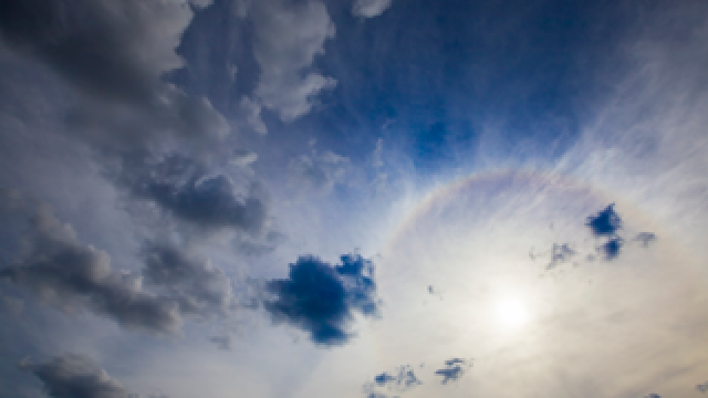 Photo: Blue sky seen from above white clouds.