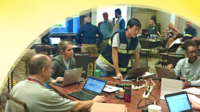 Advisory Team at a table during a response exercise