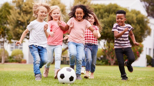 A group of kids playing soccer