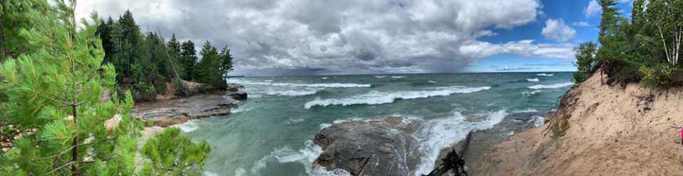 A view of clouds over an water inlet at Pictured Rock.