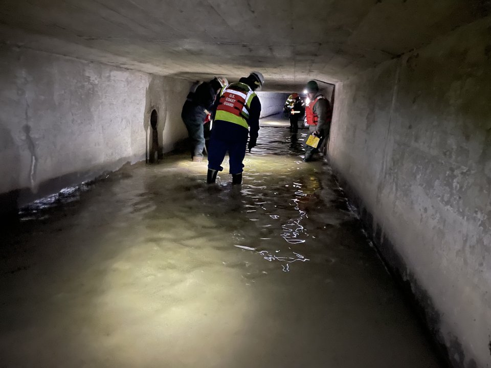 A crew assessing the 800-foot-long culvert 