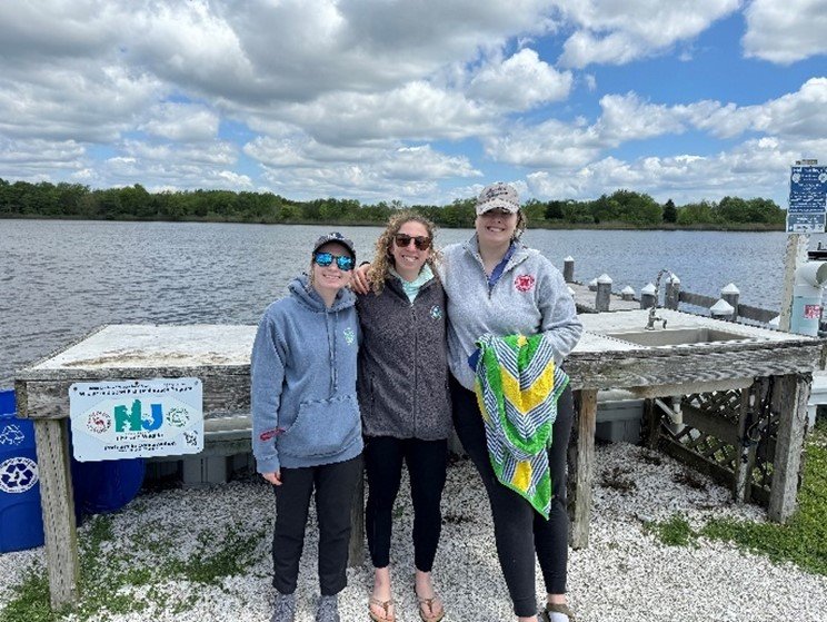 Nina Colagiovanni (NJ DEP), Cayla Sullivan (EPA Region 2), and Della Campbell (NYS DEC) during the sampling event at Barnegat Bay in New Jersey