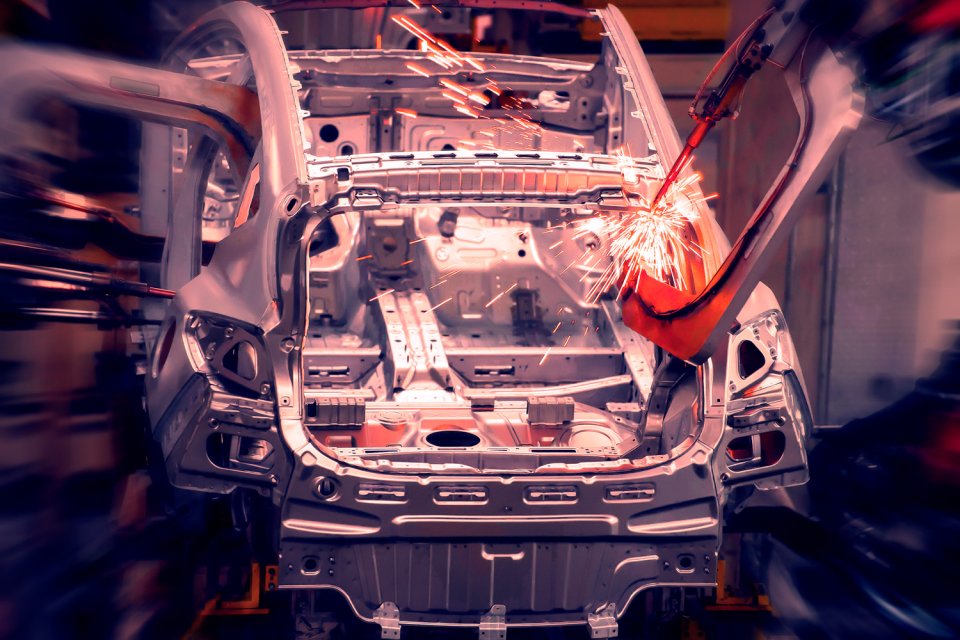 Cars being assembled in a factory