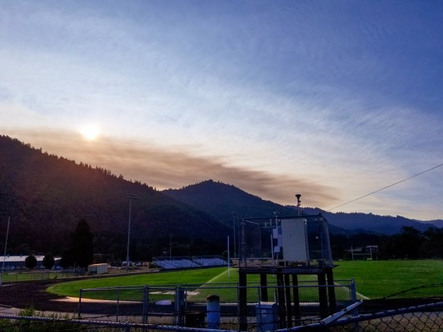 Wildfire smoke obscures the sunrise from the Hoopa Air Monitoring Platform in 2020. Credit: Brian McCaughey