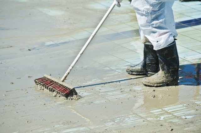 Broom being used for decontamination