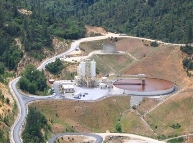 Photograph showing remediation activities including roadways, treatment equipment and vehicles