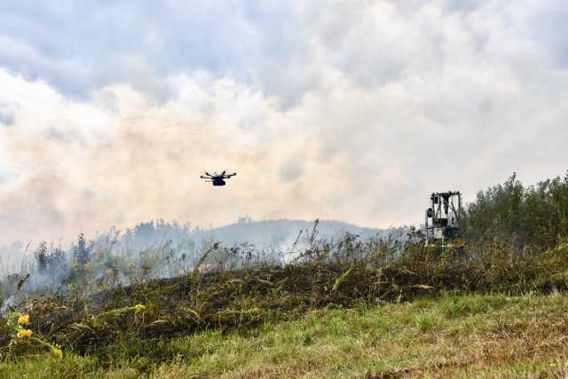 a drone flies into a smoky area