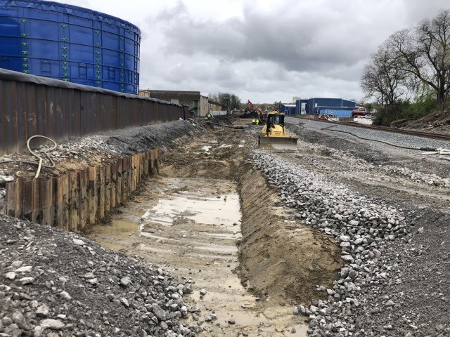 Excavated ballast and soil along the north track