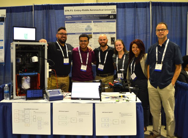 The Embry-Riddle Aeronautical University team with their low-cost air quality sensor and drone, used to measure atmospheric particulate matter levels.