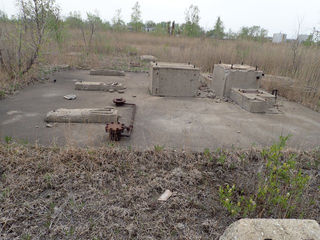 Pipes leading to the subsurface of the former structure on the former refinery portion of the site.