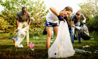 Citizens bagging up trash