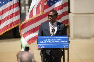 Administrator Regan standing in front of a podium that says Accelerating Clean Transportation