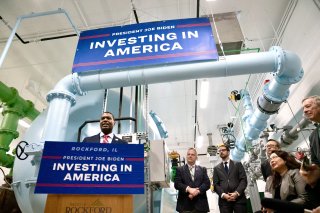 Administrator Regan at a podium, speaking at an event in Rockford, Illinois