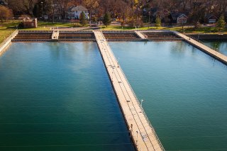 Large drinking water basin with a walkway over it