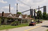 Neighborhood houses next to industrial facility