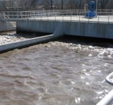 Flowing wastewater in large cement treatment units.